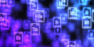 an image with a black background with the periodic elements coming into focus, colored from left to right: pink to blue.