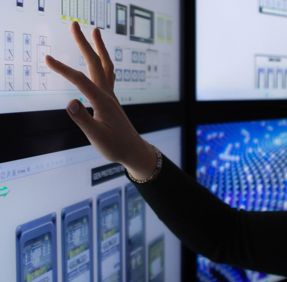 an image of a hand touching a screen with analytics displayed.
