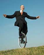 Man riding a unicycle.