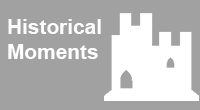 navigational icon consisting of the words Historical Moments in white text on a grey colored background and a white silhouette of a medieval type castle; hyperlink to NRC Flickr Historical Moments photo album
