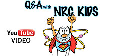 The words: Q&As with NRC Kids - which links to a video: Radiation and Other Questions. Also the YouTube icon and the word: VIDEO, and a Cartoon image of a flying Atom character wearing a Superman costume with the atom symbol for wings and its arms pointing skyward