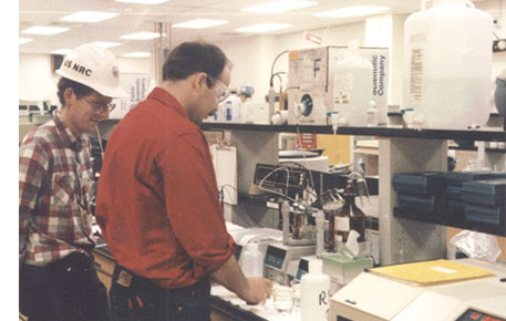 Environmental Monitorin image of NRC inspector watches sample-testing at Seabrook
