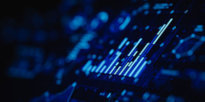 on a screen with a black background, blue charts and graphs.