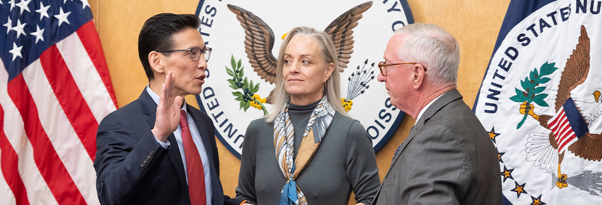 Commissioner Ho Nieh, left, is administered the oath of office by former Commissioner William Ostendorf, right, during a swearing-in ceremony at the U.S. Nuclear Regulatory Commission headquarters in Rockville, Md.