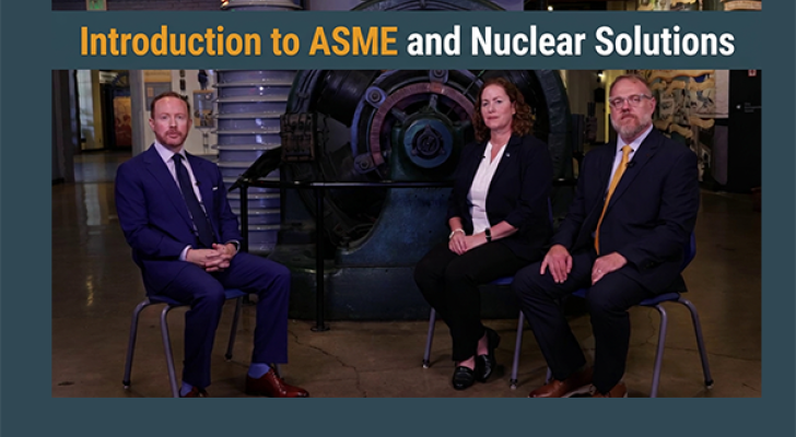 Three people sitting in front of a staged set for an interview
