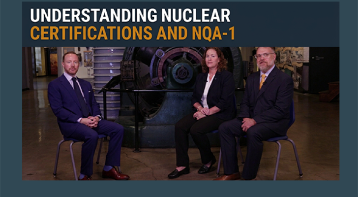 Three people sitting in front of a staged set for an interview