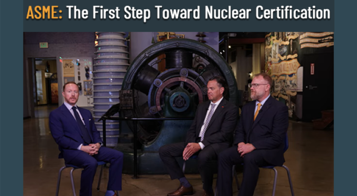 Three people sitting in front of a staged set for an interview