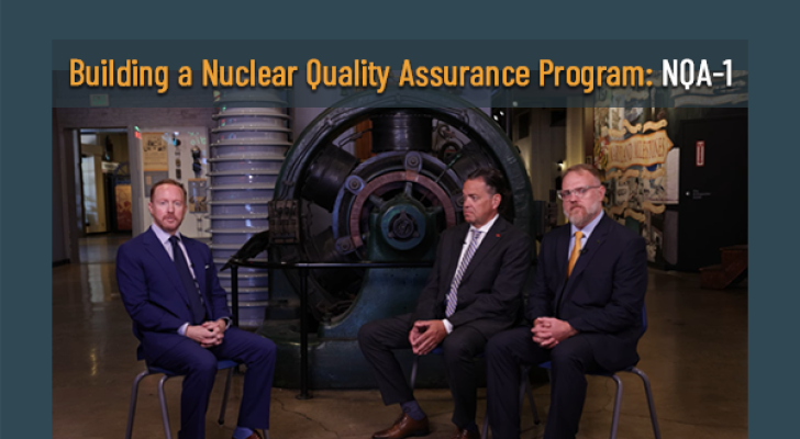 Three people sitting in front of a staged set for an interview