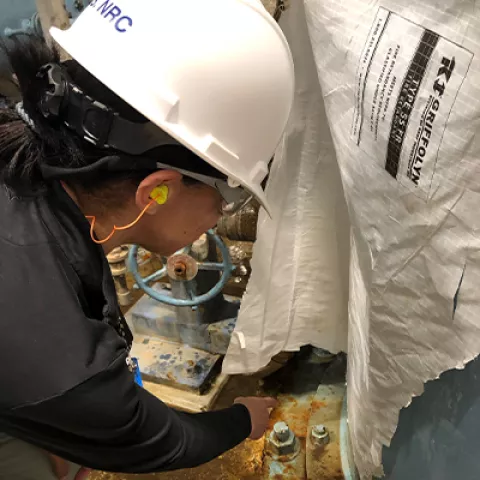 NRC worker in a hardhat